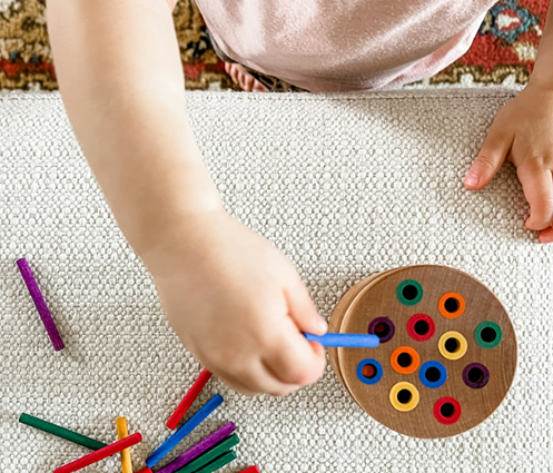 toddler playing with toys
